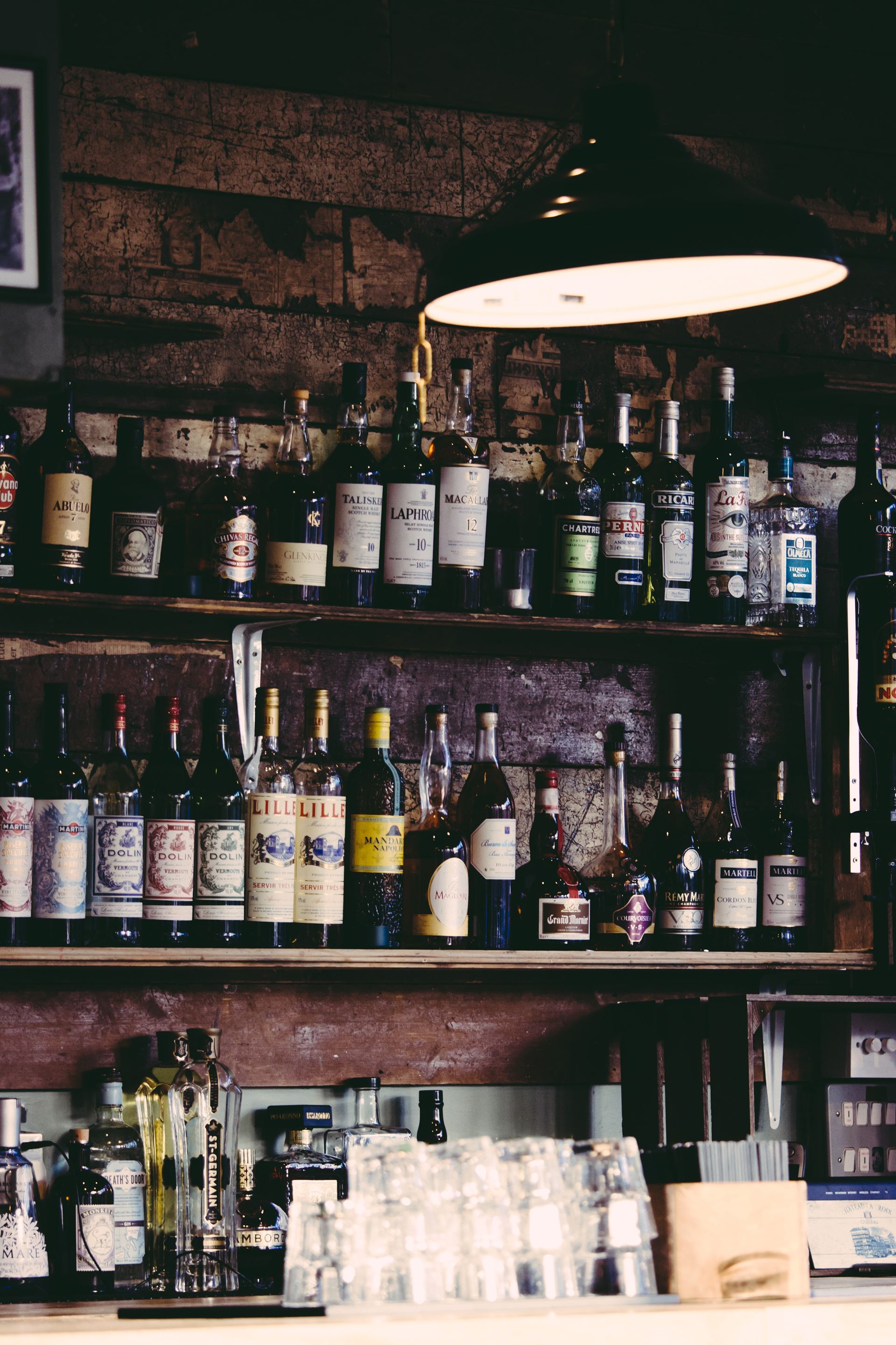 a store shelf filled with wine glasses